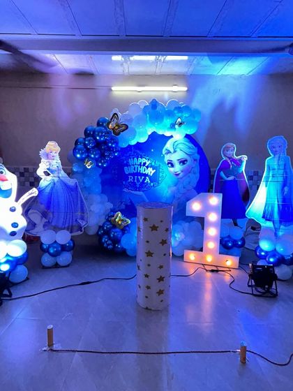 Another view of the illuminated 'Frozen' party, showing how the blue lighting and glowing characters create a truly immersive winter wonderland experience.