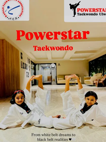 "From white belt dreams to black belt realities." Two young students demonstrate their flexibility and teamwork.