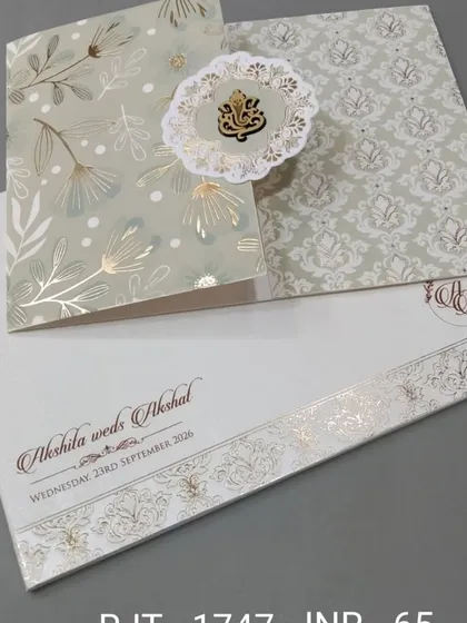 This simple and elegant card features a Ganesha emblem on a pop-out floral medallion. The design is clean, with gold foil accents for a touch of grace.