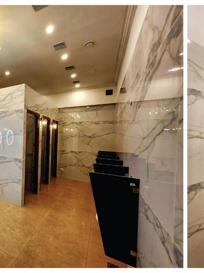 A closer look at our premium restrooms. We focused on creating a clean, luxurious, and comfortable space with marble-finish walls and modern fixtures.