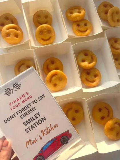 "Don't forget to say cheese!" A fun, car-themed menu card for the Smiley Station at Vihaan's birthday party. The little details make all the difference.