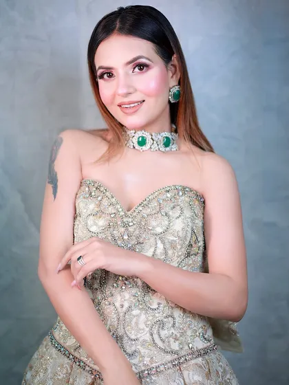 A smiling portrait in a beautiful strapless gown, showcasing a glamorous evening look.