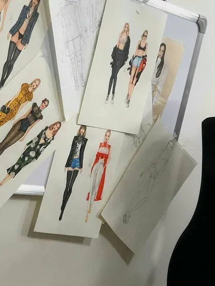 A closer look at the variety of fashion illustrations created by our students. The sketches feature different outfits, from a leopard print jumpsuit to a sheer black dress, showcasing their ability to design for diverse tastes.