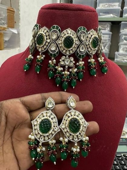 A dark green version of the meenakari choker set, perfect for a classic bridal look.