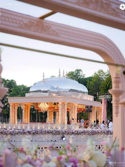 A view of the magnificent 'Saanjh Niwas' setup for the Adani wedding. Hosting events of this scale is a testament to our capability to execute grand visions, transforming open spaces into architectural marvels that honour heritage and celebration.