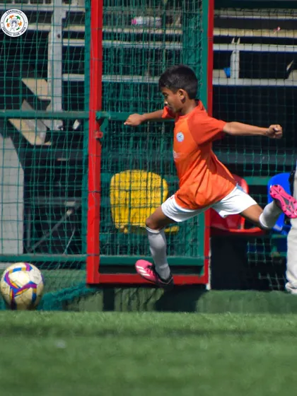 A player unleashes a powerful shot on goal. We train our players to be decisive and clinical in the final third.