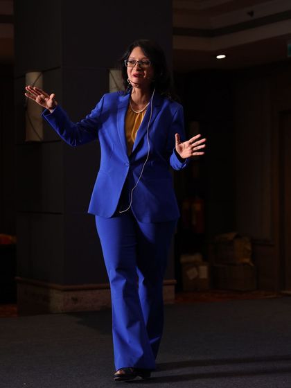 A photo of me speaking. A poem on fierceness: "Your lack of knowledge doesn't tame my fire, My fierceness burns, ever higher and higher."