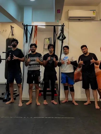 The jiu-jitsu crew after a tough rolling session. All smiles after the grind.