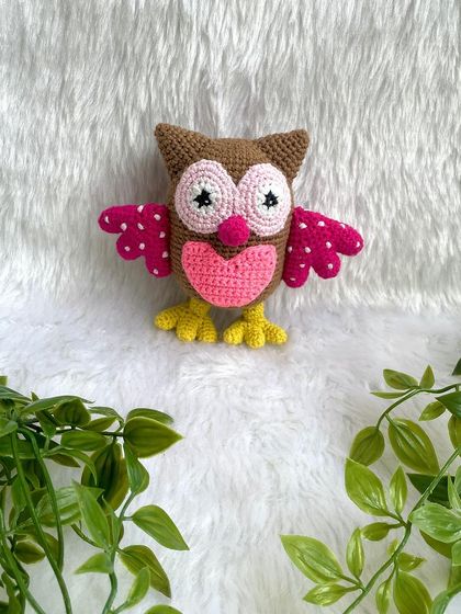 A collection of animal friends made as newborn photo props. This set includes a colorful owl, a lion, a hippo, and a bunny.