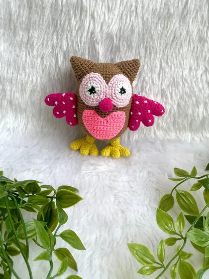 A collection of animal friends made as newborn photo props. This set includes a colorful owl, a lion, a hippo, and a bunny.