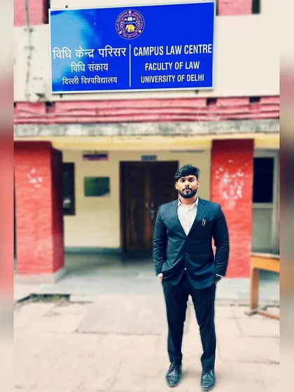 Standing outside the Campus Law Centre, where my legal career began. I am proud to be an advocate from this esteemed institution, known for producing some of the country's finest legal minds.