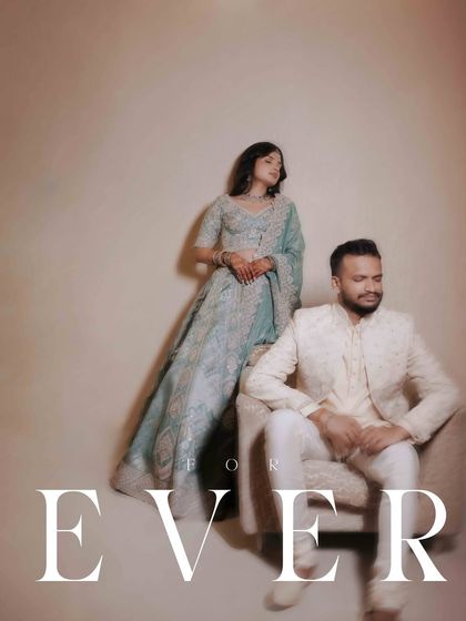 An elegant, full-length portrait of the couple with the word "Forever" overlaid. This classic shot captures the timeless promise of their engagement.