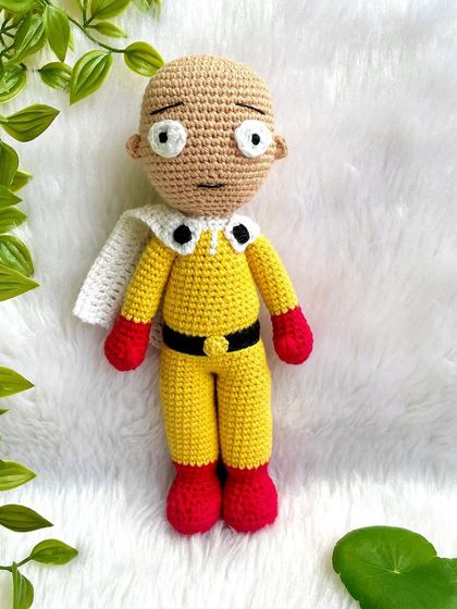 Saitama from One Punch Man! This doll captures his simple yet iconic yellow suit, red gloves, and classic unimpressed expression. It was fun to see the joy this brought to a fan.