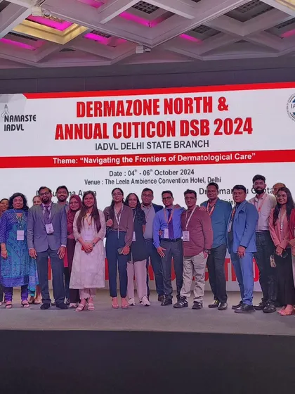 Another group photo from the DERMAZONE stage, celebrating a successful event.