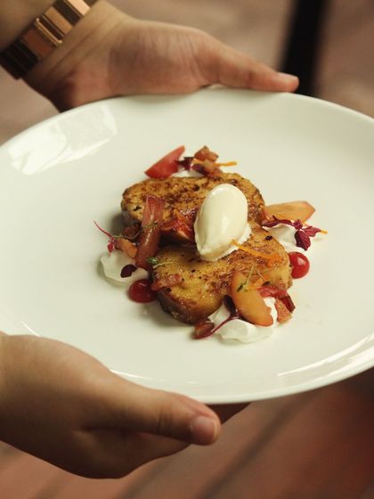 My Bacon Pain Perdu. This dish blurs the line between breakfast and dessert, featuring brioche French toast with bacon bits, whipped creme fraiche, and elderflower ice cream.
