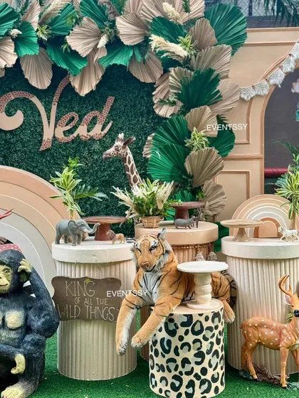 Detailed view of the dessert stands and animal figures, showing how every element is tied into the wild jungle theme.