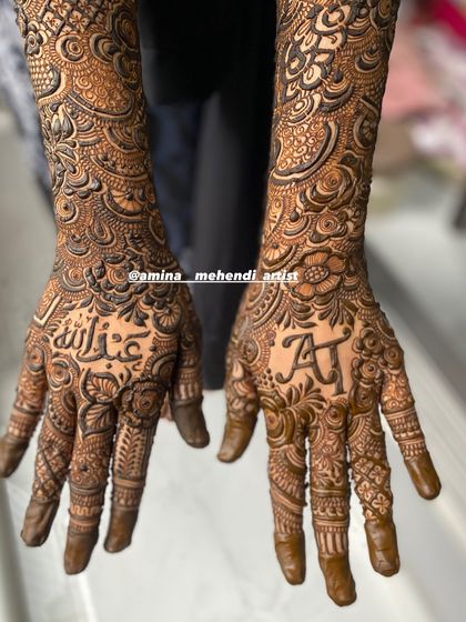 A clear shot of the palms with the initial 'A' and the name 'Abdullah'.