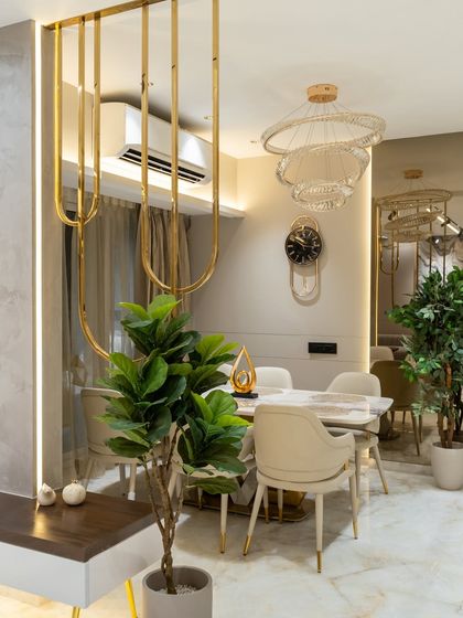 Step into a dining space that redefines minimal luxury. Soft beige hues, polished PU finishes, and half-round HDHMR mouldings bring structure and subtle sophistication. The gold accents and mirror cutouts bounce light across the space, making it feel open and airy.
