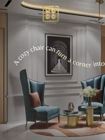 This image captures the essence of our design philosophy. A cozy chair, elegant wall art, and thoughtful lighting combine to create a corner perfect for quiet moments.