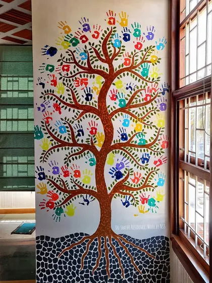 Art can be interactive and fun. This 'Tree of Life' mural for a kids' room was a collaborative project where the children added their own handprints, creating a colorful and personal piece of art that they can cherish as they grow.