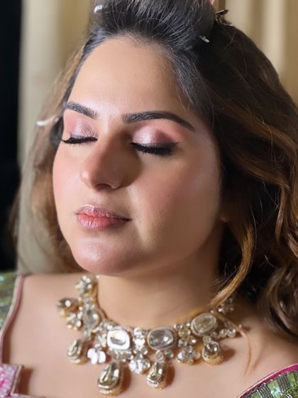 A close-up of the soft, rosy-toned makeup for this Roka look. The no-filter approach shows the real texture of the skin, which is glowing and healthy.