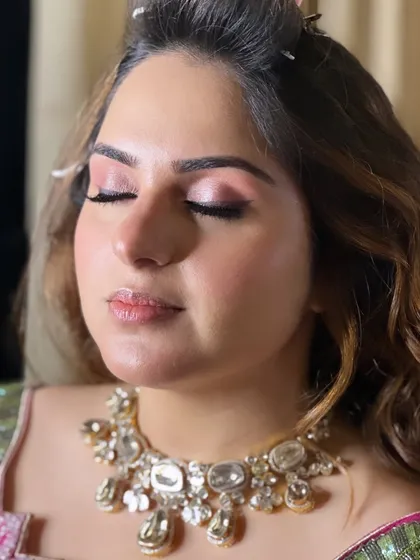 A close-up of the soft, rosy-toned makeup for this Roka look. The no-filter approach shows the real texture of the skin, which is glowing and healthy.