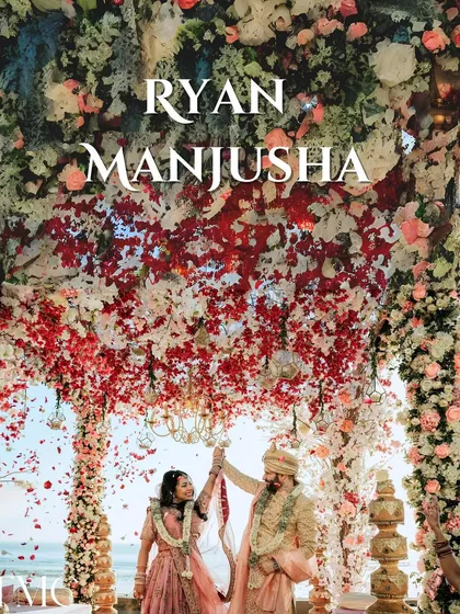 This is the moment every story builds towards. A spectacular shower of petals rains down on the couple during their beachside varmala ceremony, creating an unforgettable, epic frame against the ocean backdrop.