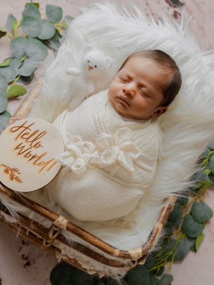 "Hello World!" This shot includes a lovely wooden milestone plaque, perfect for birth announcements and sharing the happy news.
