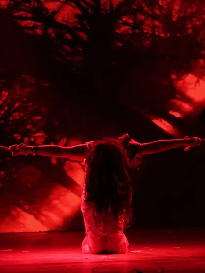 Creating a mood with dramatic lighting. This powerful silhouette shot is from a contemporary piece, where we use lighting design to enhance the emotional impact of the choreography.