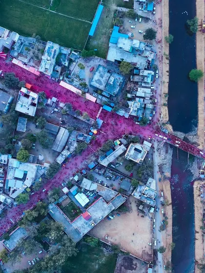 The streets of Barsana, stained pink from the Holi celebrations, as seen from above. The color flows through the town like rivers.