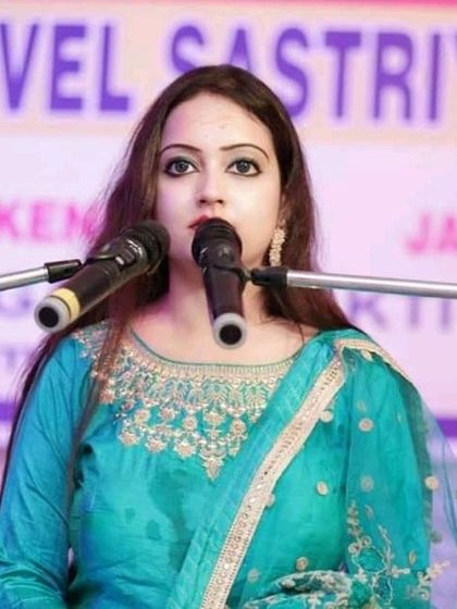 Ms. Sohini Ghosh during a vocal performance. She is an expert in both classical singing and Kathak dance.