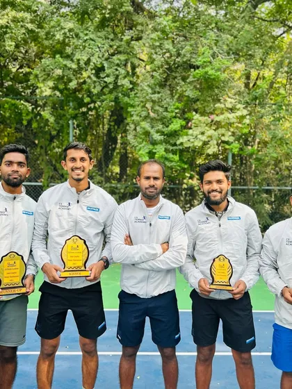 A lineup of our talented coaches with their awards from the 2023 tournament.