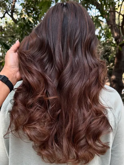 This is my 'Chocolate Pecan Dream' creation. We started with a faded base and gave her this incredibly rich, warm brown with delicate pecan highlights. The result is a glossy, healthy-looking color that’s perfect for any season.