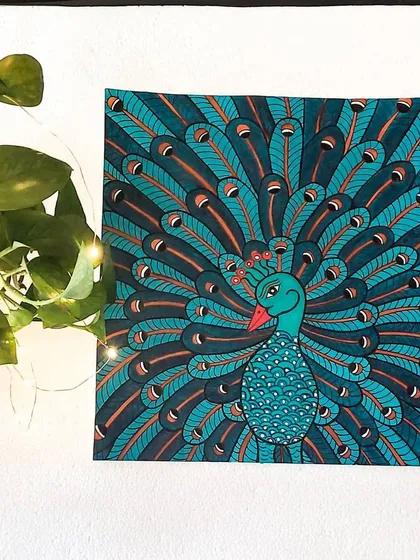 A peacock with its feathers on full display, painted in the detailed Kerala mural style. The repeating patterns and shades of blue and teal are meant to capture the bird's magnificent beauty and freedom.
