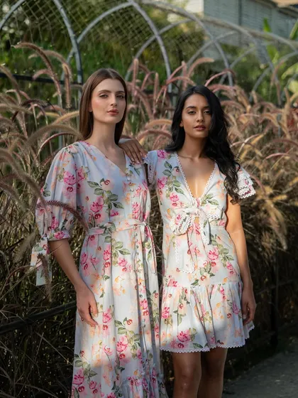 Another look from the Tangerine Tiger campaign. The models are posed together to showcase two different dress styles from the same floral collection, ideal for showing product variety.