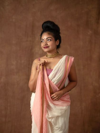 Another pose from my creative series. The focus is on the texture of the fabric and the unconventional way the pallu is styled.