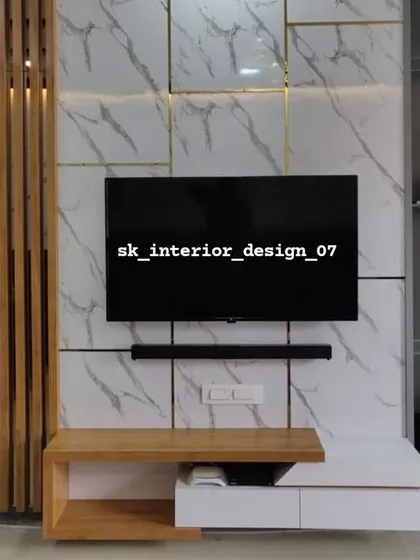 A compact TV unit with a striking combination of a marble-finish wall and vertical wooden slats. The floating console provides storage without taking up floor space.