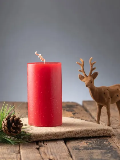 A classic red pillar candle, perfect for any Christmas decor. The curled wick adds a little touch of whimsy.