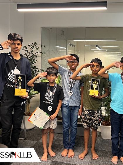 Young champions saluting with their trophies and medals after the Independence Day tournament, a proud moment for them and for the entire Klub.