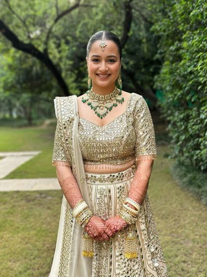 A full, happy smile from this gorgeous bride. The natural, outdoor lighting shows how the makeup looks fresh and not at all heavy.
