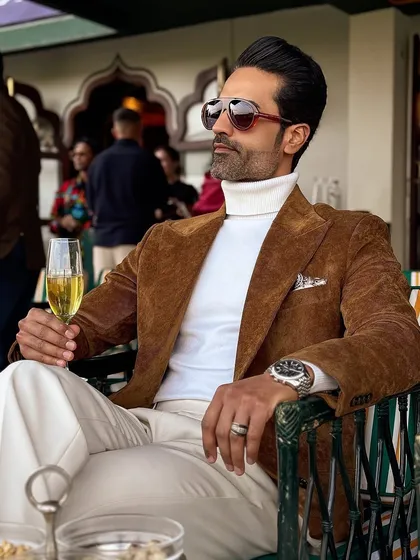 A classic look for a polo match. Our brown corduroy blazer paired with a white turtleneck and trousers for an effortlessly elegant sporting day outfit.