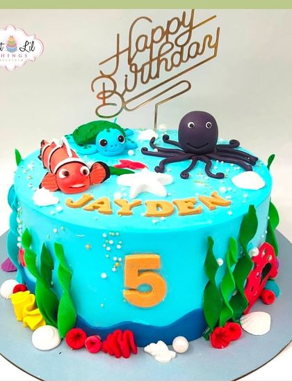 An underwater adventure for Jayden's 5th birthday. This cake features characters from Finding Nemo, including Nemo, Squirt, and an octopus.