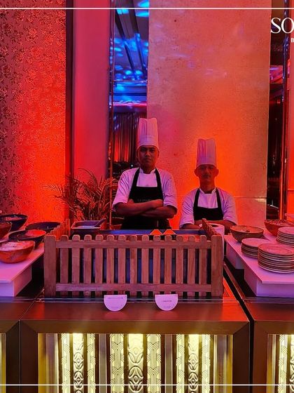 Our chefs ready to serve at a live station during a high-energy celebration event. We maintain our standards of excellence and presentation in every setting.
