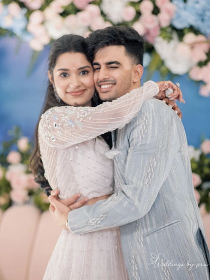 A sweet moment between Yash and Sakshi during their Roka ceremony. We created a romantic atmosphere with soft lighting and a beautiful floral backdrop for their first celebration as a couple.