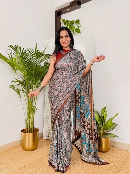 I love the unique color combination of brown, blue, and beige in this printed workwear saree. It's a sophisticated print that looks very elegant for meetings or presentations.