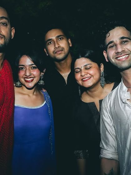 Posing with friends and guests during the Diwali celebration. These events are about community and good times, and I love being a part of it.