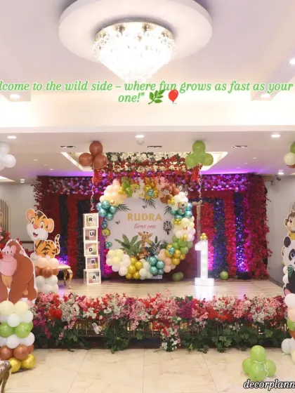 Welcome to the wild side! This grand jungle-themed setup for a first birthday party shows how I can transform a large venue into an immersive experience. With a custom backdrop, vibrant balloon arrangements, and adorable animal cutouts, I create a playful safari adventure for the little ones.