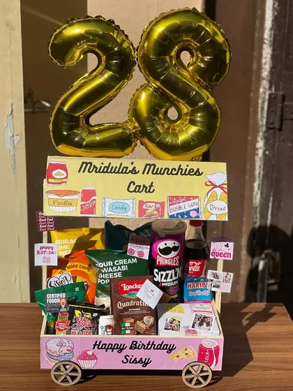 Looking for a truly unique gift? My custom 'Flour Power Carts' are a party in themselves. This 'Munchies Cart' was created for a birthday, filled with all her favourite snacks, from gourmet popcorn to international candies, and personalized with photos and notes.