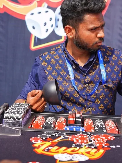 A professional croupier at a casino-themed wedding event. I can arrange for all the necessary equipment and staff to create an authentic casino experience.