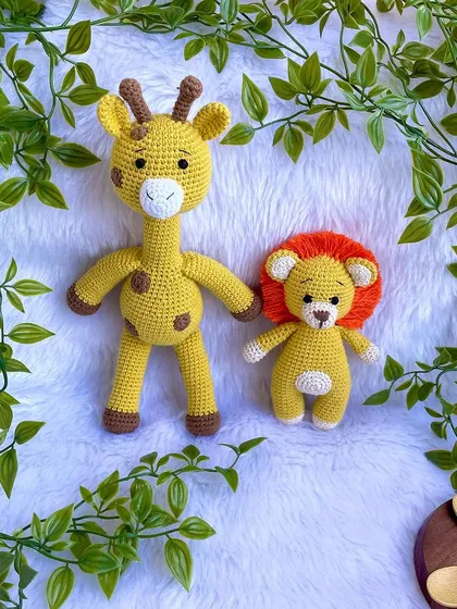 A friendly duo of a giraffe and a lion. These two best friends are perfect for jungle-themed nurseries and imaginative play.